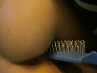 Big ass babe using a toothbrush as a sex toy